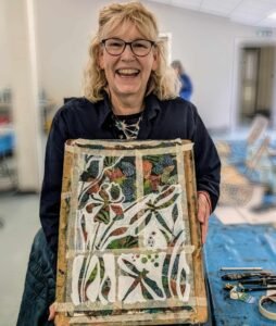 Happy Basingstoke student showing her work in progress.