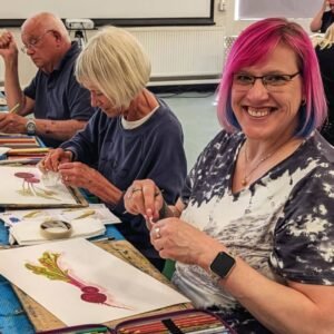Happy Basingstoke students painting beetroot.