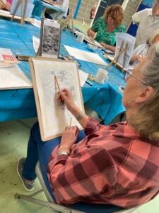 newbury-student-sketching-stream