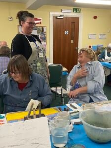 newbury-tutor-laughing-with-student